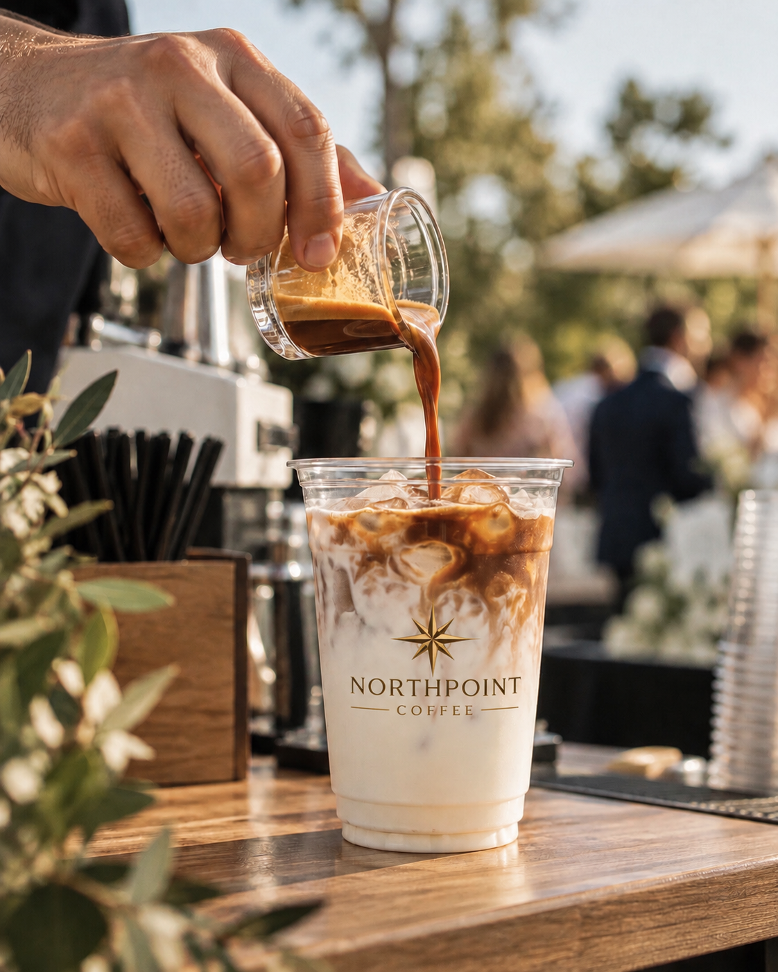 Espresso poured over ice into a branded Northpoint cup on a film set